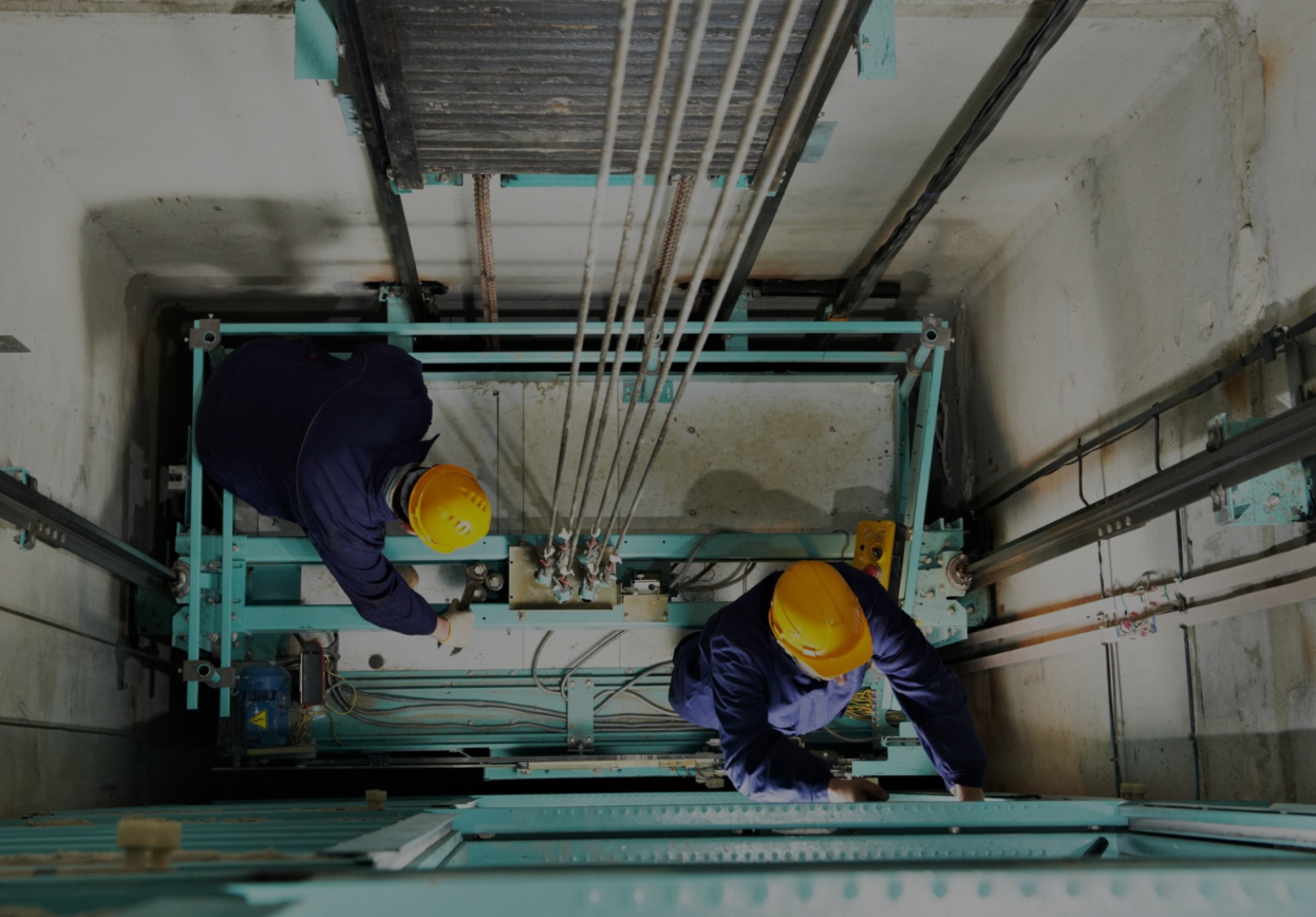ENGELS technicians working inside an elevator shaft